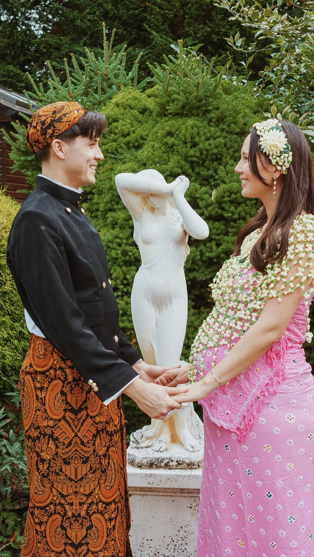 Couple photographed during an Indonesian maternity celebration