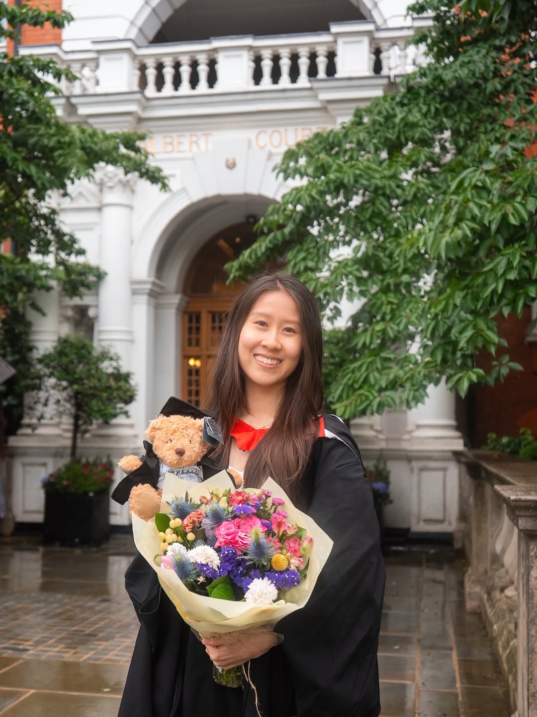 Graduate photographed in academic dress with Big Ben in the background