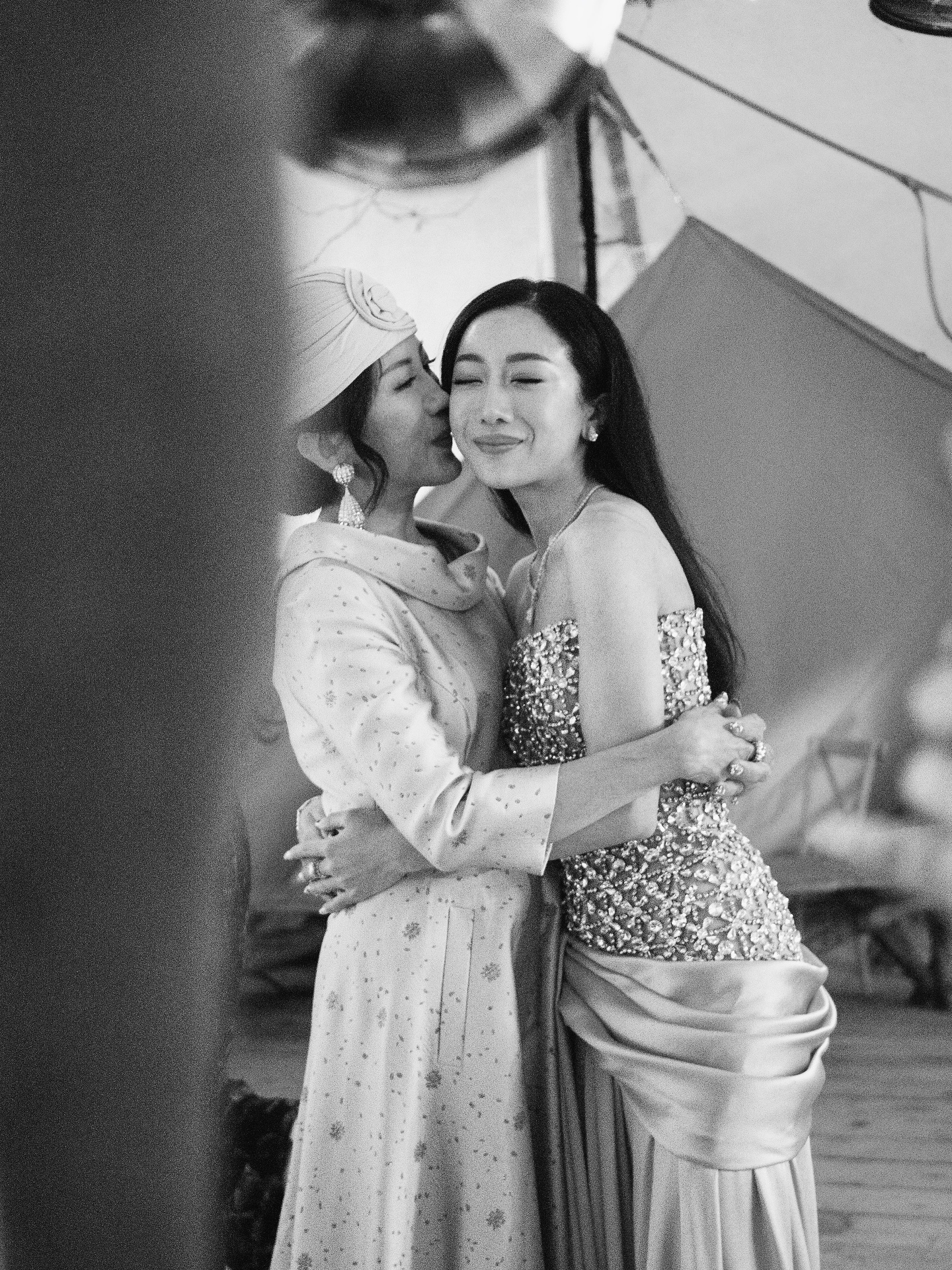 Mother of the bride embracing a wedding guest during a destination wedding